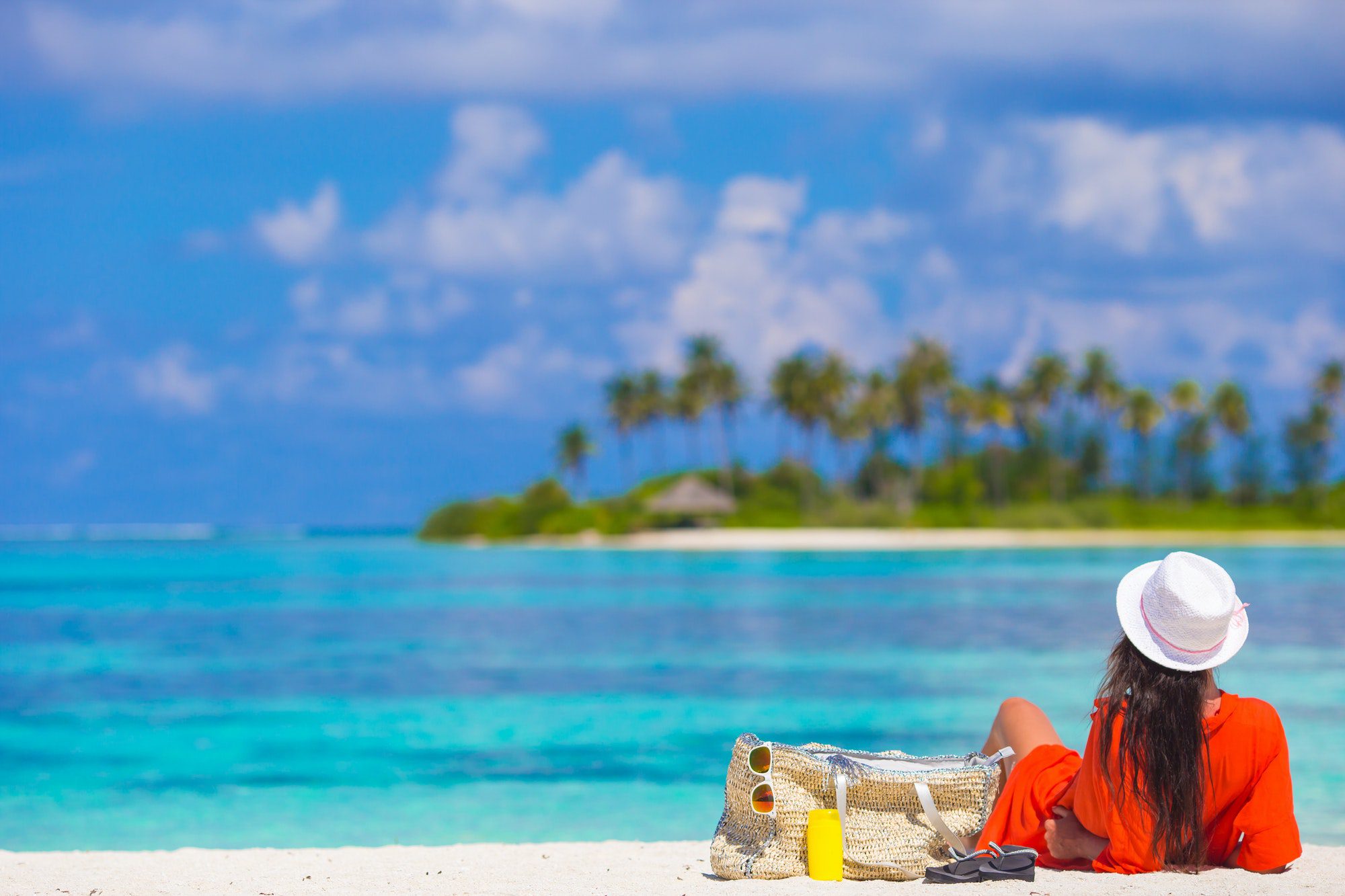 Beautiful young woman relaxing at beach