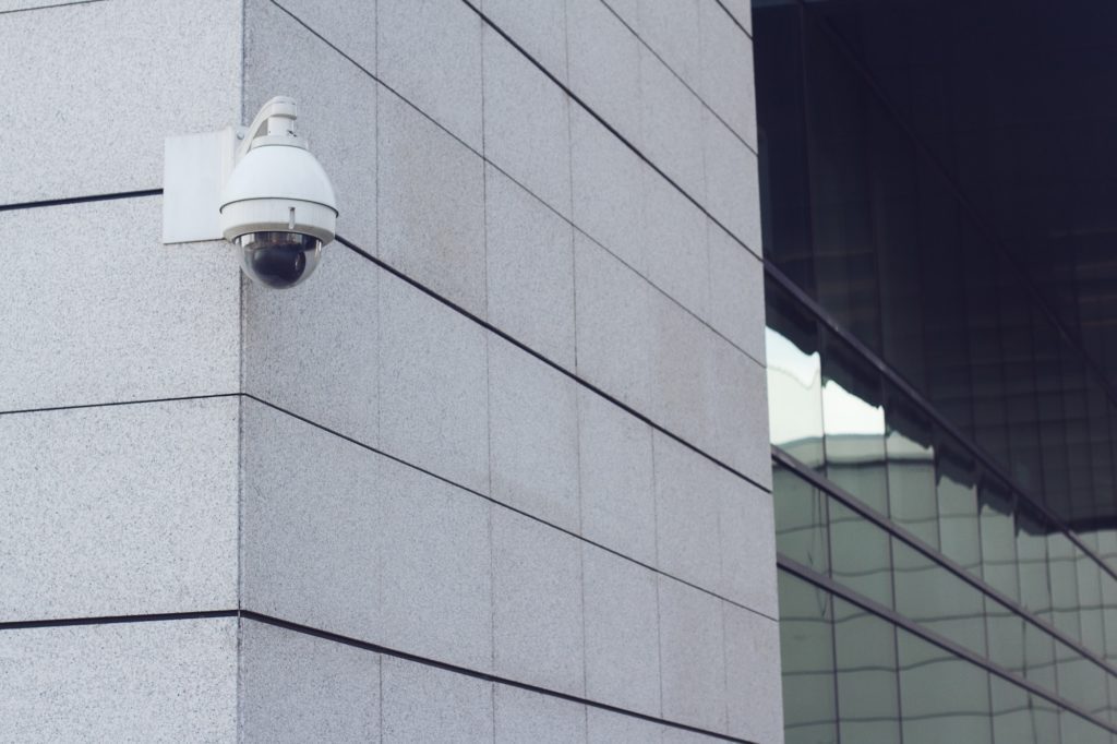 surveillance round camera on building wall