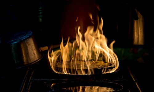 Close up cooking the delicious traditional Thai food of fry oyster shell in a pan with fire, Close up cooking the delicious traditional Thai food of fry oyster shell in a pan with fire,