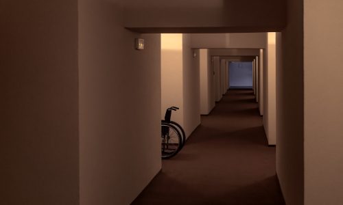 Wheelchair in hospital corridor