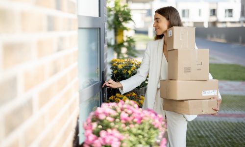 Woman coming home with a parcels